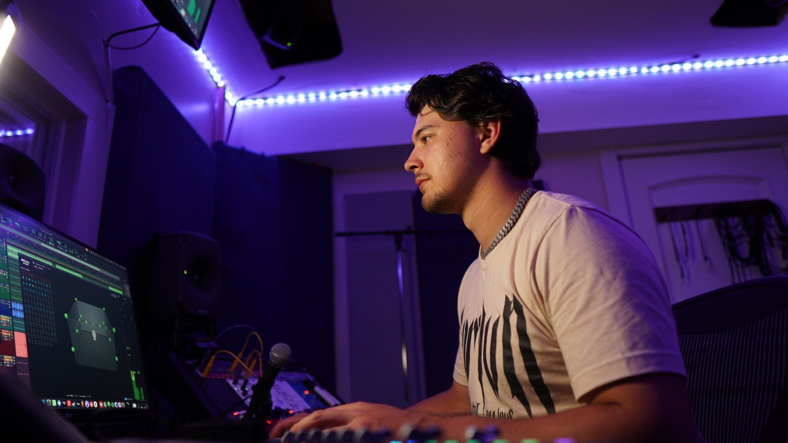 Wayne Romero in studio at mixing console